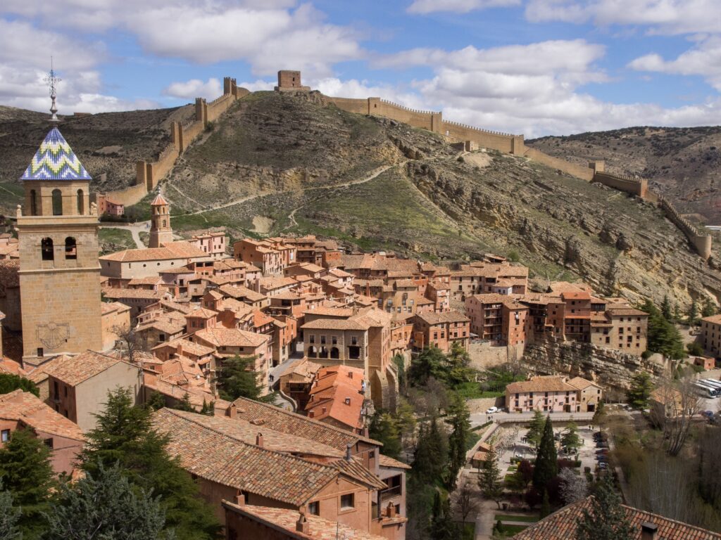 Medieval hilltop town of Albarracín, Spain with ancient city walls and terracotta rooftops – Travel Crock
