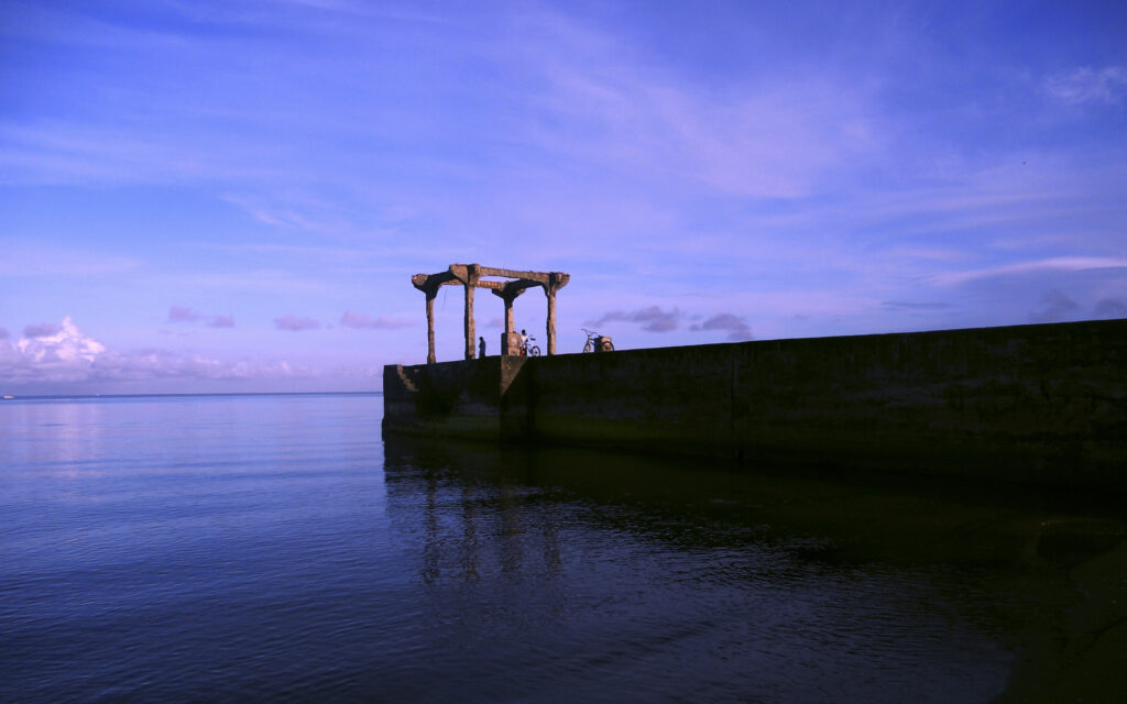 Silhouetted structure on Laylay Port in Boac, Marinduque at dusk with calm ocean waters and purple sky – Travel Crock