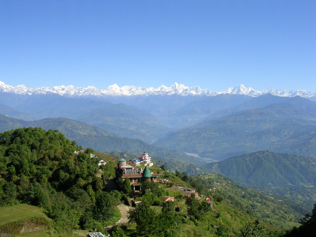 Panoramic view of snow-capped Himalayan peaks from the green hills of Nagarkot, Nepal – Travel Crock