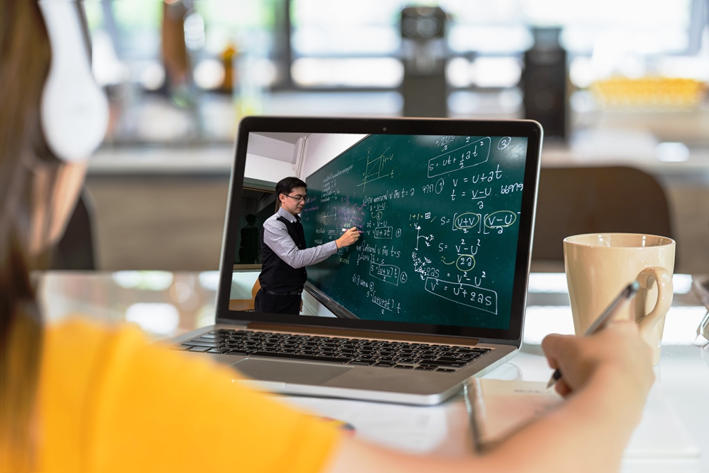 "Student attending an online class with math instructor on laptop screen – Digital Course Creation"